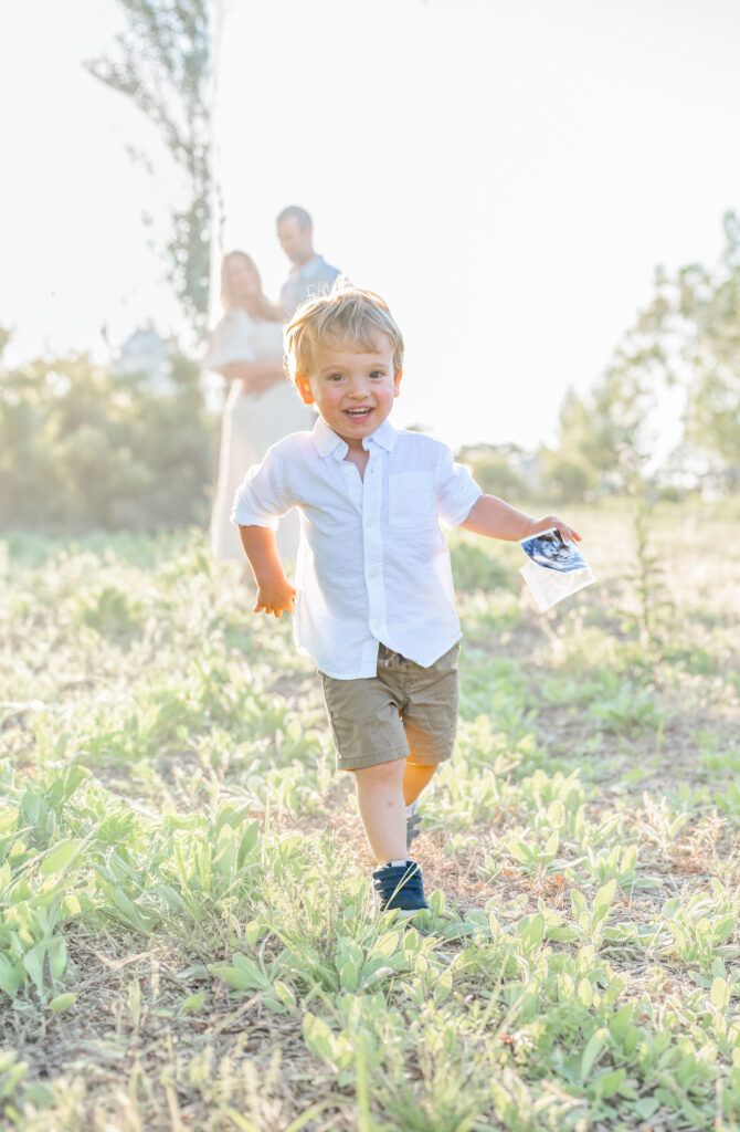 Boy running with ultrasound by Apex Family Photographer 