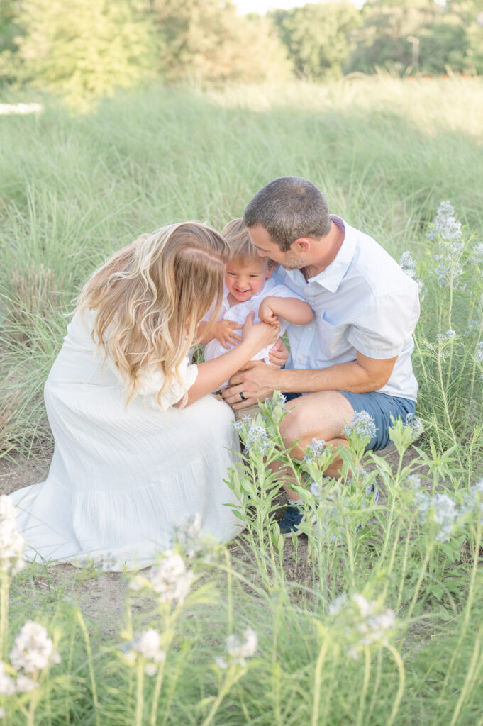 Family Cuddling By apex Newborn Photographer 